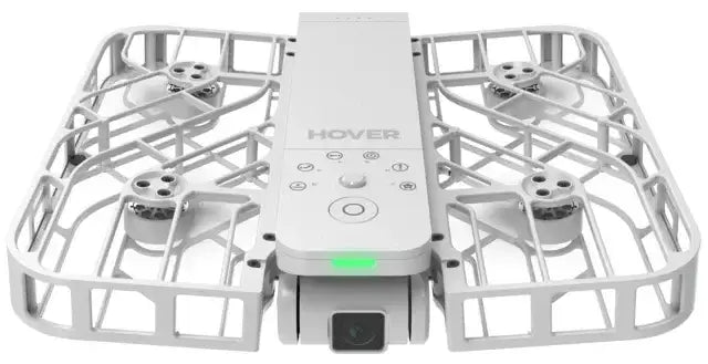 Vit Hover Air drönare med skyddande ram och inbyggd kamera, sett framifrån på vit bakgrund